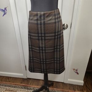 Neutral plaid meets classic tailoring — versatile for work or weekend style.